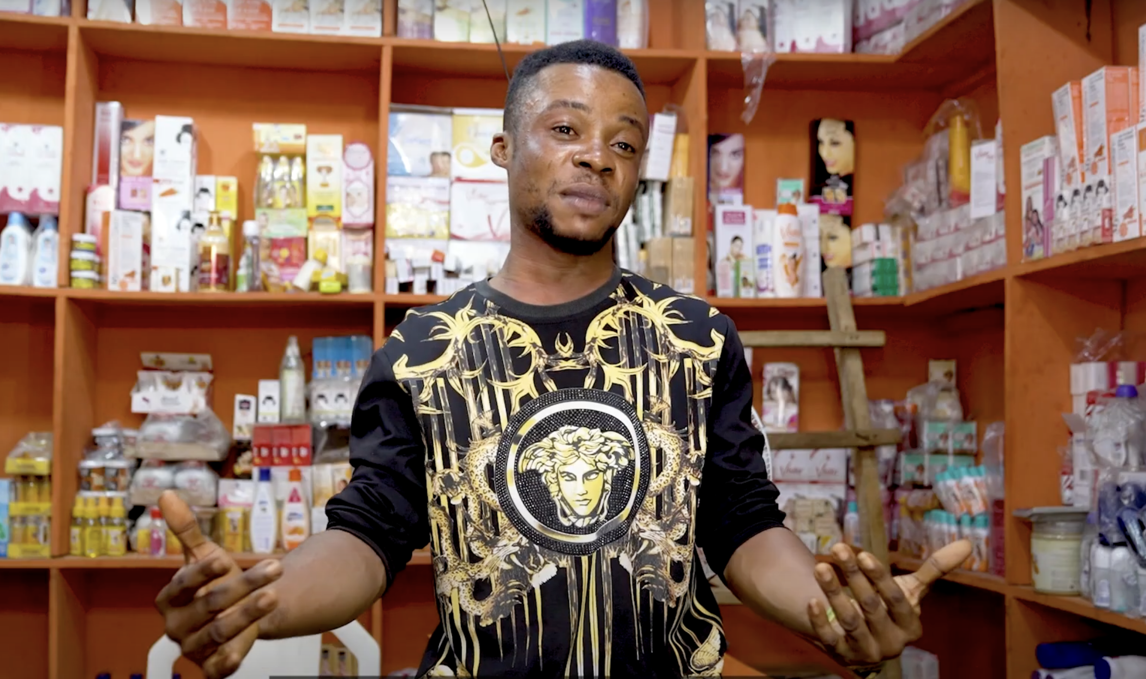 Man stands in shop in Nigeria