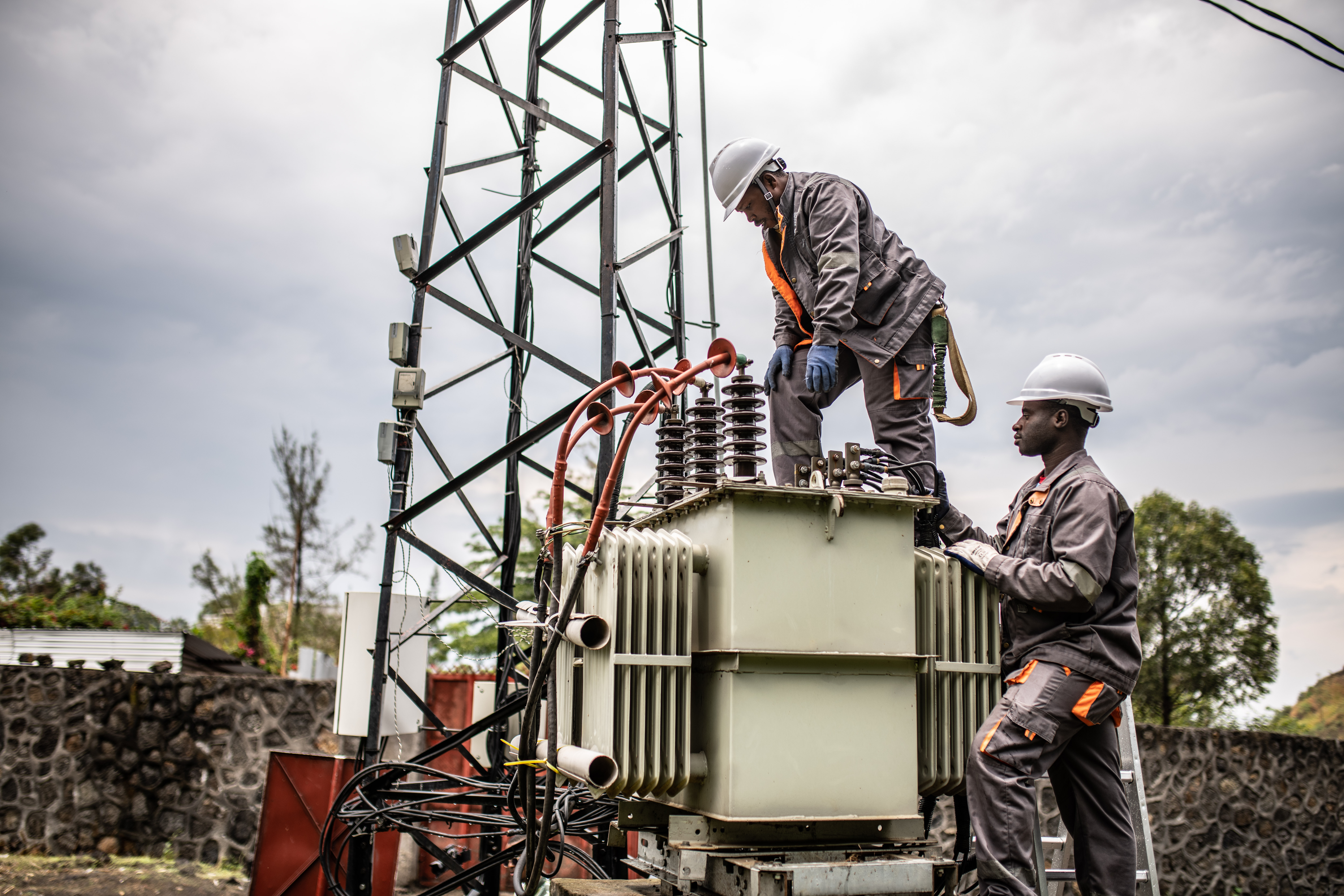 Distributed Renewable Energy in the Democratic Republic of Congo doing maintenance.